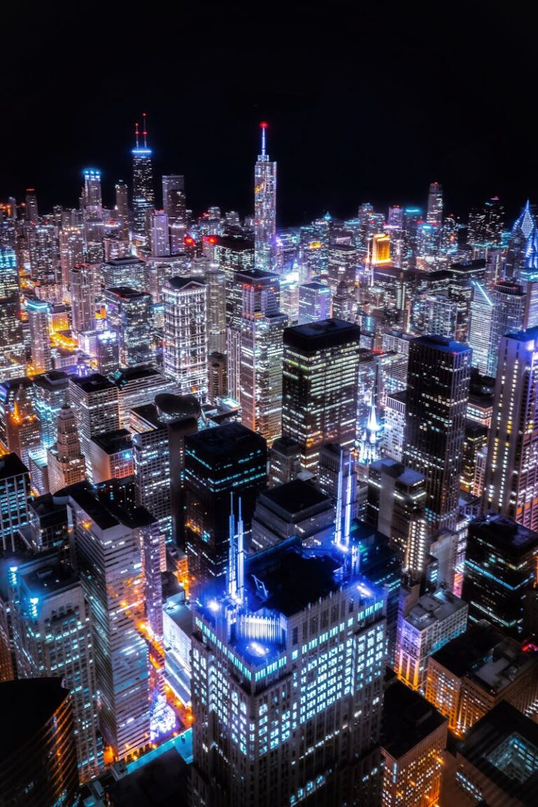 Stunning aerial view of Chicago's illuminated skyline with skyscrapers lit up at night.